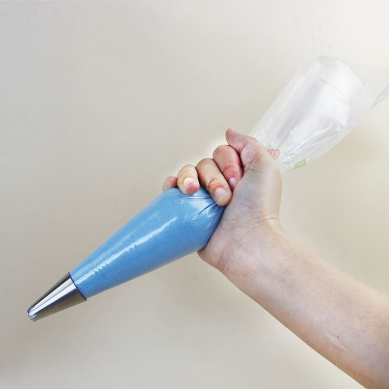 piping bag with cake decorating nozzle